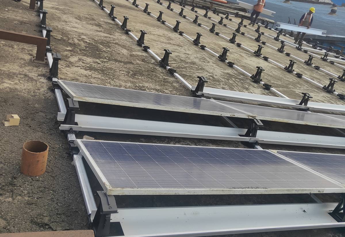 Solar module mounting structure rails laid out on an industrial rooftop